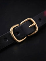 Choker and Necklace, close up of gold adjustable buckle on leather choker strap