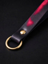 Choker and Necklace, detailed shot of metal O ring and rivet on leather strap