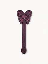 Paddle Spanking, butterfly embossed dark burgundy leather paddle, ideal for Best Date Ideas, isolated on clean white background