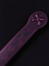 Paddle Spanking, detailed shot of small butterfly stamp on paddle handle, lovely for Best Date Ideas