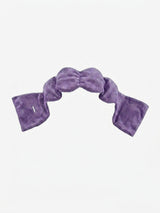 A contoured weighted sleep mask laid flat, one of the best weighted sleep masks for ergonomic eye coverage