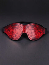 red snake print leather eye mask contoured eye shape black elastic strap faux leather sleep mask dark grey background stylish sleeping accessory