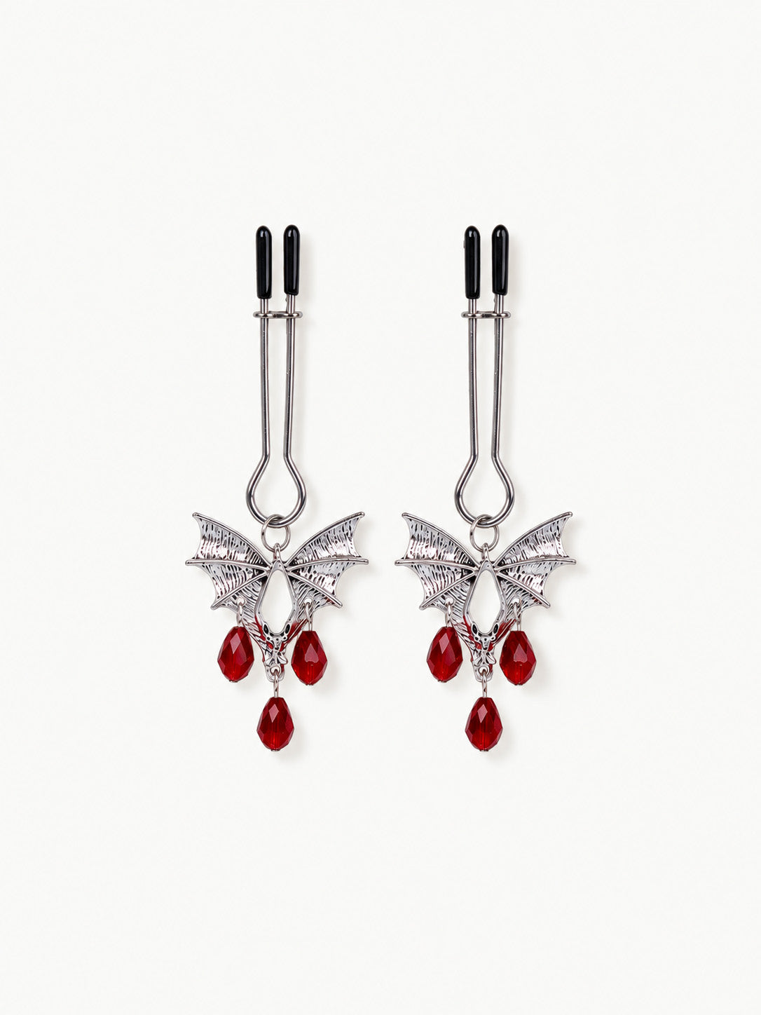 gothic bat design nipple clamps antique silver finish hanging red teardrop crystal beads black rubber tips decorative fashion accessory isolated on white background