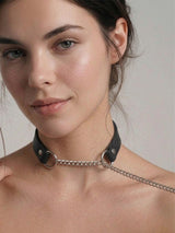 Pulling Fashion and Fun Choker draped along the collarbone, showcasing the extended chain design