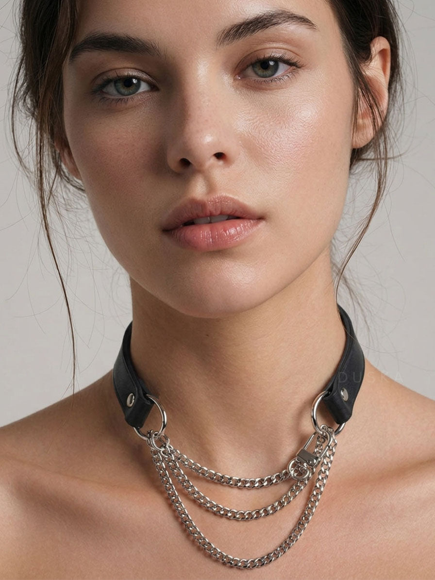 Front view of the Pulling Fashion and Fun Choker featuring a black leather band and chain layers