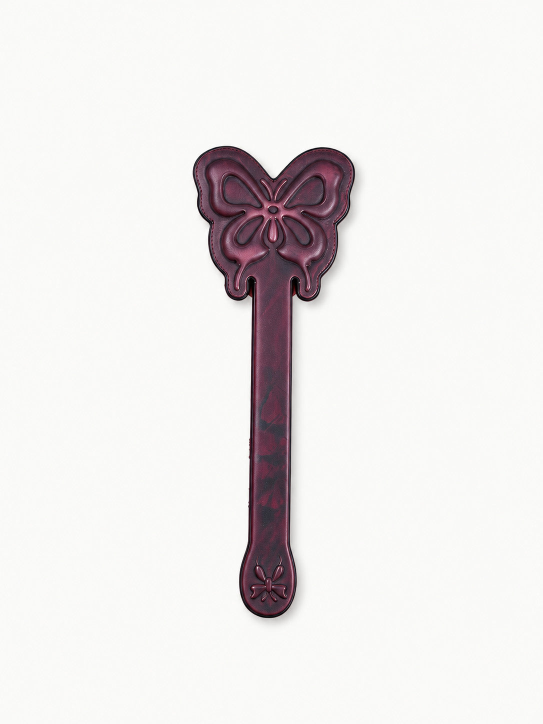 full view of thermochromic leather butterfly paddle embossed butterfly patterns deep plum leather isolated on plain white background