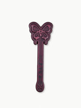 full view of thermochromic leather butterfly paddle embossed butterfly patterns deep plum leather isolated on plain white background