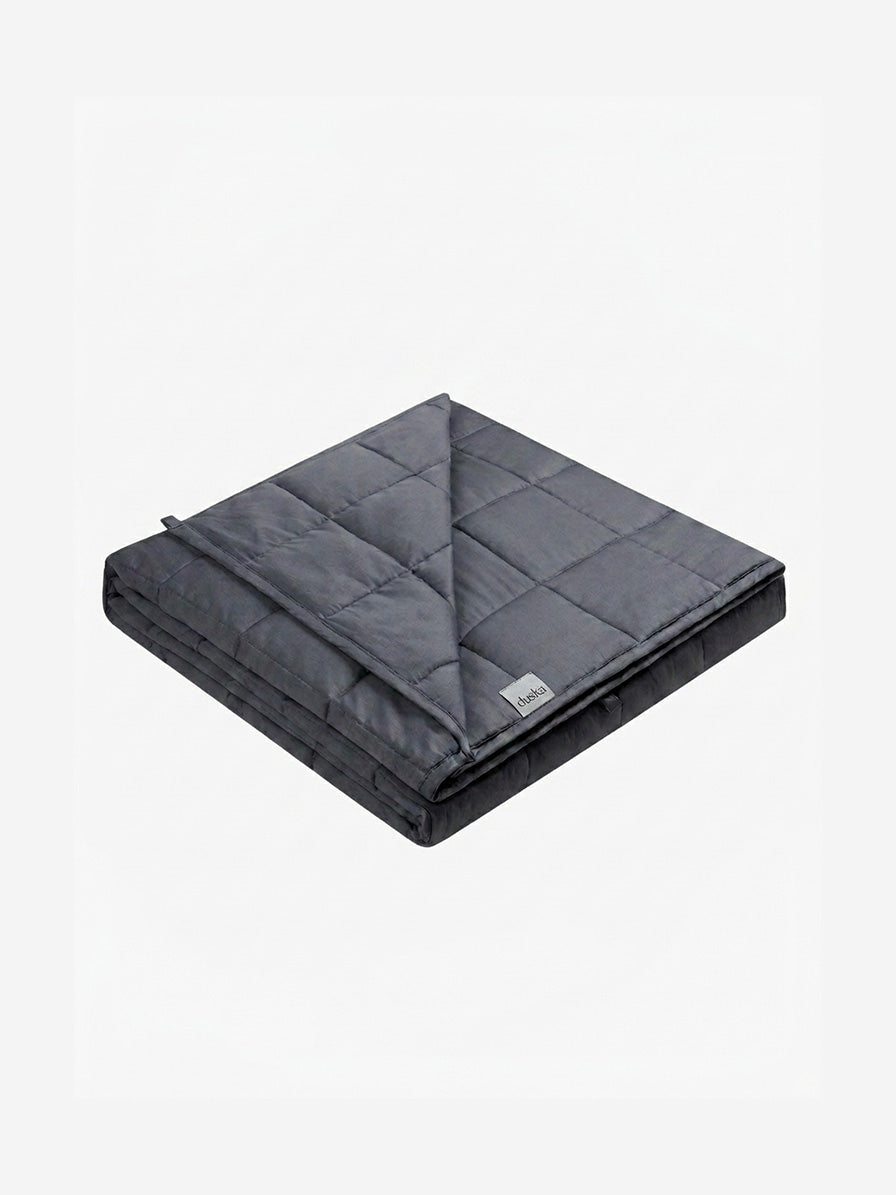 Duska weighted blanket folded, showing quilted grid stitching in charcoal grey